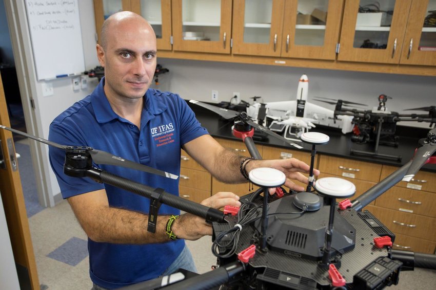 Dr. Ampatzidis with an agricultural drone in his lab at SWFREC.