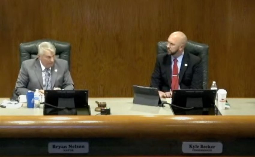 Apopka Mayor Bryan Nelson and Commissioner Kyle Becker discuss the economic development department before the City Council voted 3-2 in favor of the initiative.