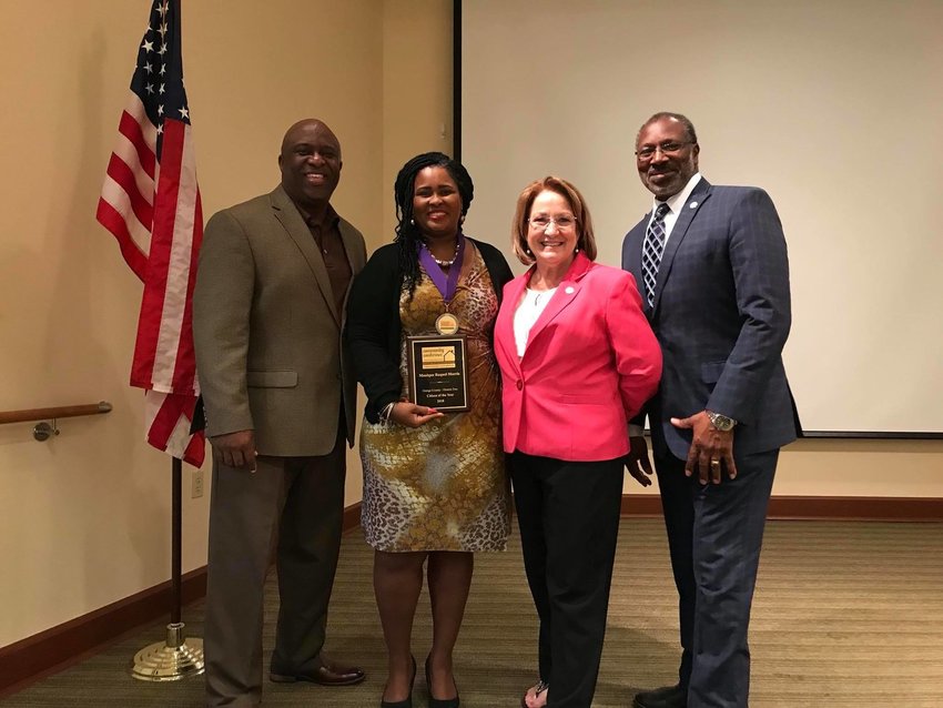 Monique Morris receiving the 2018 Orange County District 2 Citizen of the Year award.
