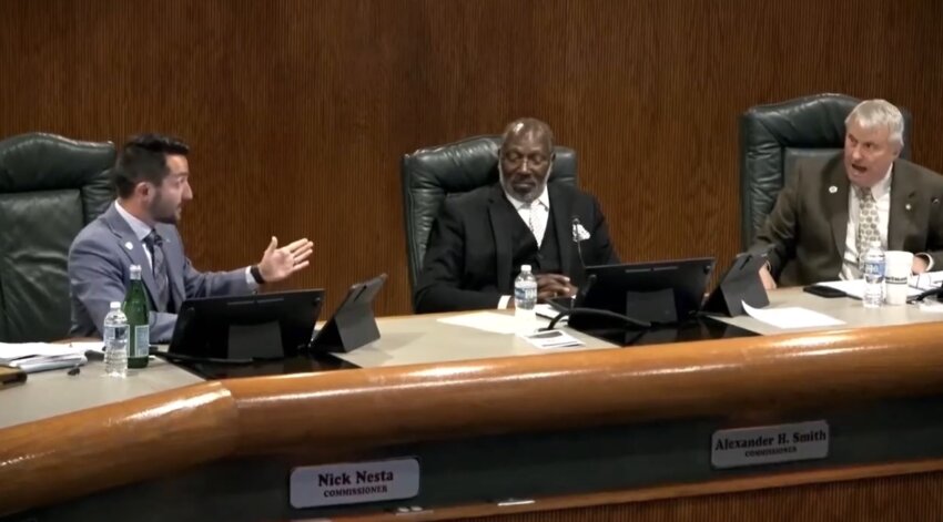 Commissioner Nick Nesta (left) clashes with Mayor Bryan Nelson (right) about social media threats.