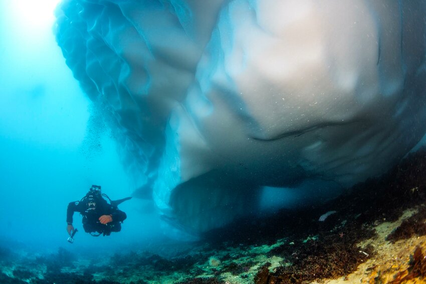 John navigates around an iceberg. (Photo by Becky Schott of Liquid Productions)