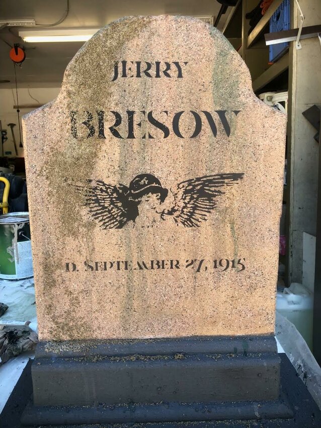 Tombstones made from wood share details of real people who were buried in the Ethel cemetery, and whose actual tombstone’s are no longer on the property. Volunteers added, aging, and other paint techniques to give them a weathered look.