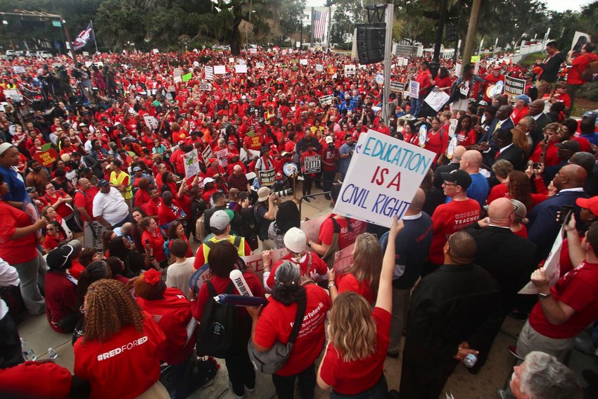 Teachers and supporters march Monday, Jan. 13, 2020, during the Florida Education Association's &quot;Take on Tallahassee&quot; rally at the Old Capitol in Tallahassee, Fla. Phil Sears / AP