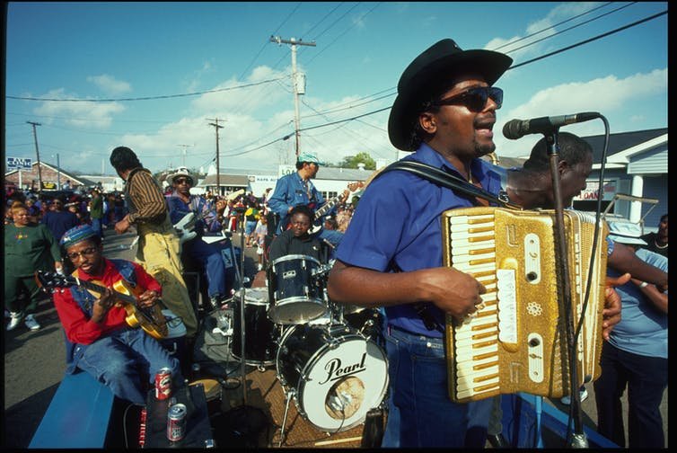 Nathan Williams and his band play zydeco from the back of a truck in a Lousiana Mardi Gras parade.&nbsp;Philip Gould/Corbis via Getty Images