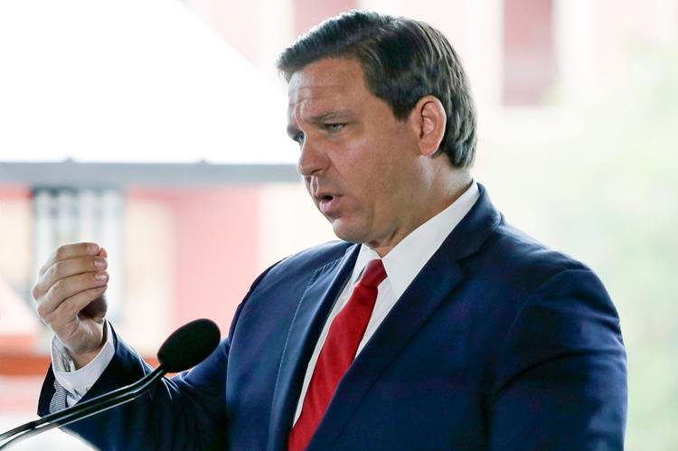Florida Gov. Ron DeSantis speaks at a news conference at Universal Studios on Wednesday, June 3, 2020, in Orlando, Fla.  John Raoux / AP