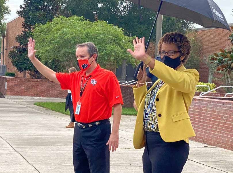 Orange County Public School Superintendent Dr. Barbara Jenkins waves to returning students at Winter Park High School, Friday, August 21, 2020