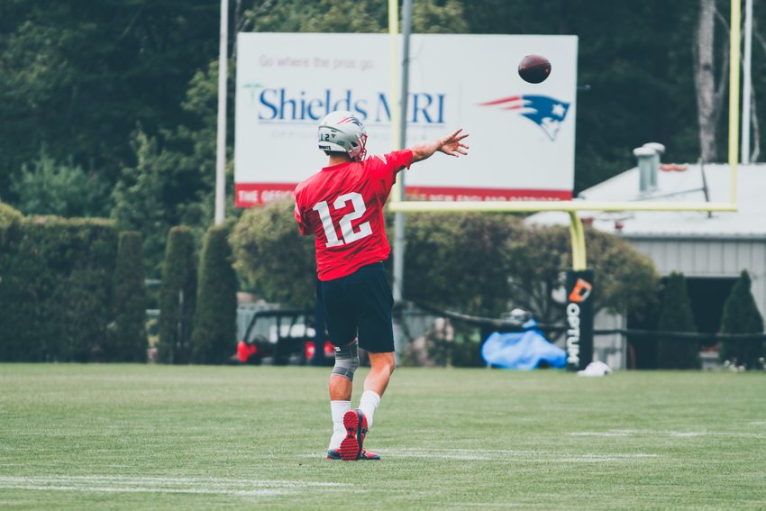 Brady trains during a practice in Foxborough, Massachusetts; photo by Cian Leach on Unsplash