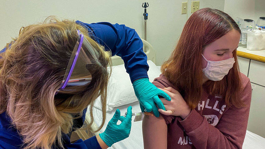 A teenager receives a shot in a clinical trial of Pfizer&rsquo;s COVID-19 vaccine. Cincinnati Children's Hospital