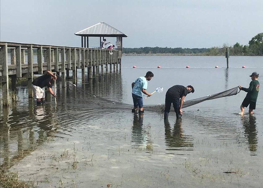 These Florida High School students participated in a water resources field study program through the District&rsquo;s Blue School Grant Program. Students are pictured seining at Crescent Lake.