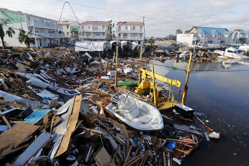 In this Oct. 11, 2018 file photo, a boat sits amidst debris in the aftermath of Hurricane Michael in Mexico Beach, Fla.  Gerald Herbert / AP file photo