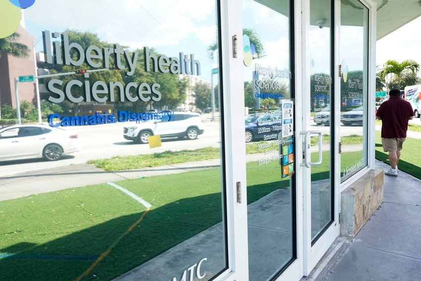 A client exits Liberty Health Sciences Cannabis Dispensary, Thursday, Feb. 25, 2021 in Florida. AP Photo / Marta Lavandier