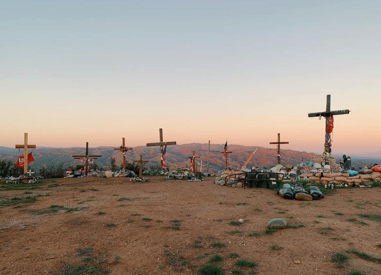 Crosses in honor of fallen Marines stand atop a hill near Camp Pendleton, California.