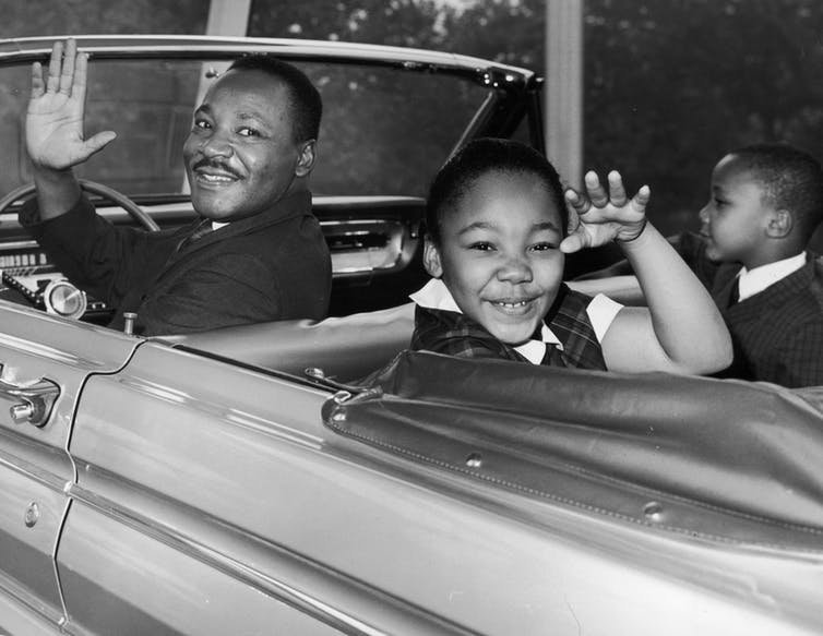Martin Luther King Jr. waves with his children, Yolanda and Martin Luther III, from the 1964 World&rsquo;s Fair in New York City.