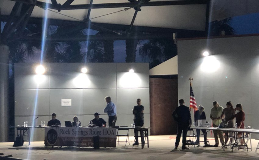 Rock Springs Ridge residents and representatives from Specialty Management conclude their count of the 323 ballots in the RSR HOA election at the Apopka Amphitheater Tuesday night.