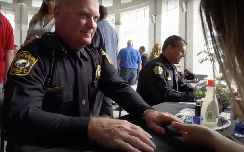 Apopka Police Chief Michael McKinley joins the Manicure Movement to fight child abuse.