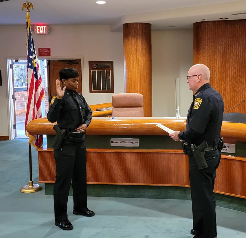 Apopka Police Michael McKinley swears in new APD Officer Kimberly May.