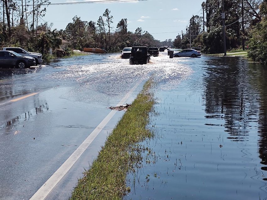 Motorists contending with standing water in North Port, Florida. Sept. 30, 2022.