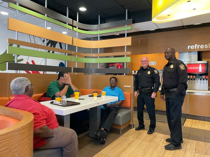 Apopka Police Chief Michael McKinley and Deputy Chief Jerome Miller treat Apopka residents to free coffee at the Coffee with a Cop event this week.