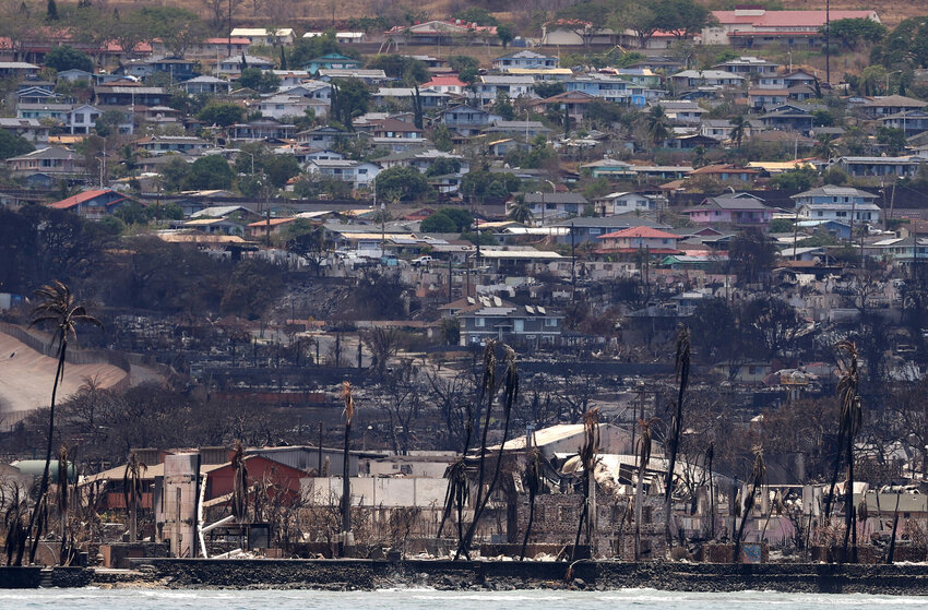 LAHAINA, HAWAII - AUGUST 14: Homes and businesses destroyed by a wildfire are seen on August 14, 2023, in Lahaina, Hawaii. At least 93 people were killed, and thousands were displaced after a wind-driven wildfire devastated the towns of Lahaina and Kula this past week. Crews are continuing to search for nearly 1,000 missing people.
