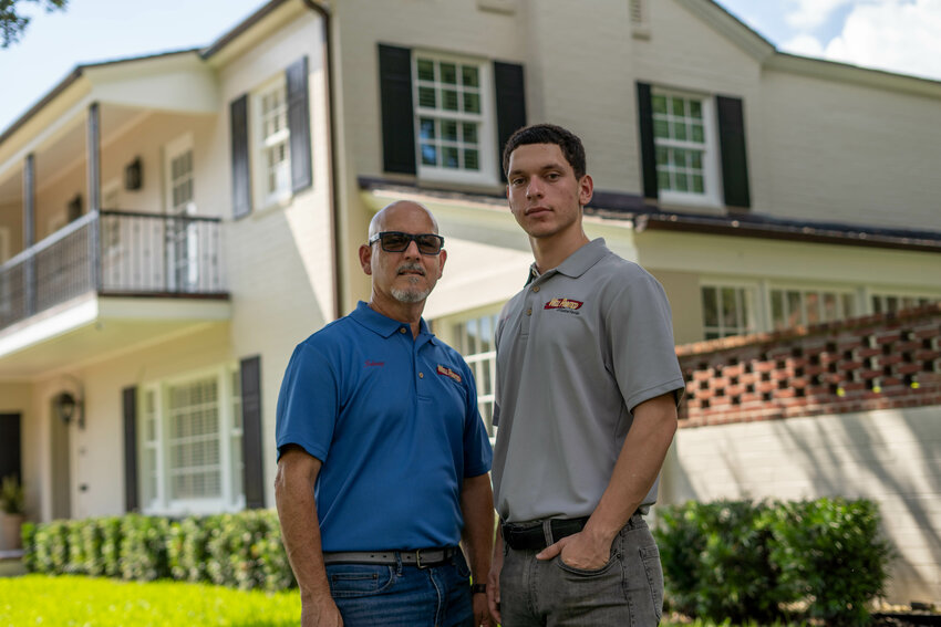 Johnny Abreu, owner of Well Painted of Central Florida, with his son, Randy