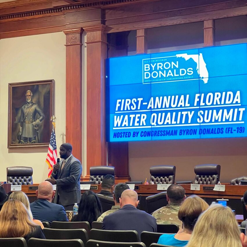 U.S. Rep. Byron Donalds addresses his secret water quality summit in the Lee County Commission chambers (note the portrait of Robert E. Lee).