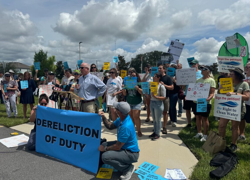 Protesters assemble at the St. Johns River Water Management District buil;ding in Apopka.