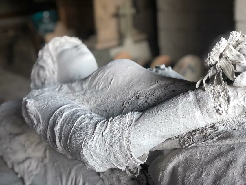A stone-like statute represents the women of Ethel Township. Created by volunteers, it was made to honor the many nameless women who once lived here. The dress on the statue was owned by Mary Lavonnie “Vonnie”  Jeffries born in 1878. It was donated to help create authenticity to the memorial.