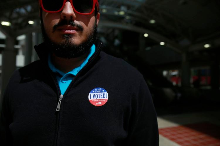 A voter wears an "I voted" sticker outside an early polling site on Monday, March 2, 2020, in Miami.
Brynn Anderson / AP