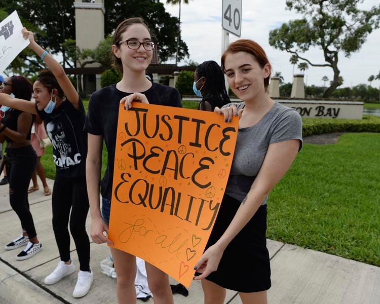 Protesters seen demonstrating during the protests for George Floyd on Monday, June 8, 2020, in Boca Raton, Fla. 
mpi04/MediaPunch / AP
