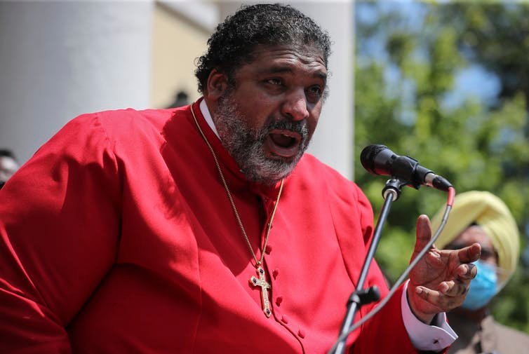 Rev. Dr. William J. Barber II addresses protesters gathered at St. John’s Episcopal Church in Washington D.C. Oliver Contreras/For The Washington Post via Getty Images