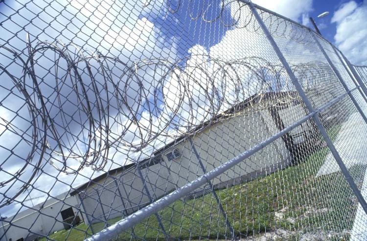 Barb wire is seen at the Dade Correctional Institution near Florida City, Fla.Joseph Sohm | Shutterstock.com