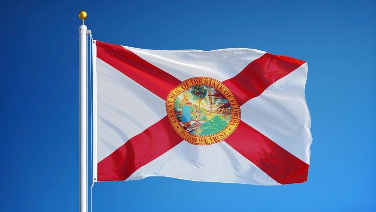The Florida state flag flies. railway fx / Shutterstock.com