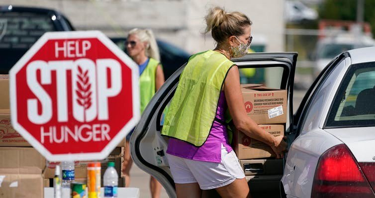 Food banks are busier than ever during the COVID-19 pandemic. AP Photo/Charlie Neibergall