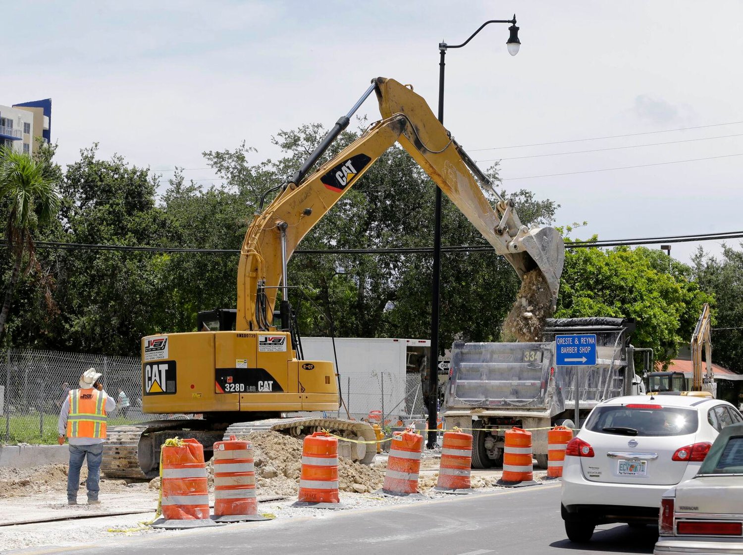 A 328D LCR Caterpillar excavator works on a road construction site in Florida. AP Photo/Alan Diaz