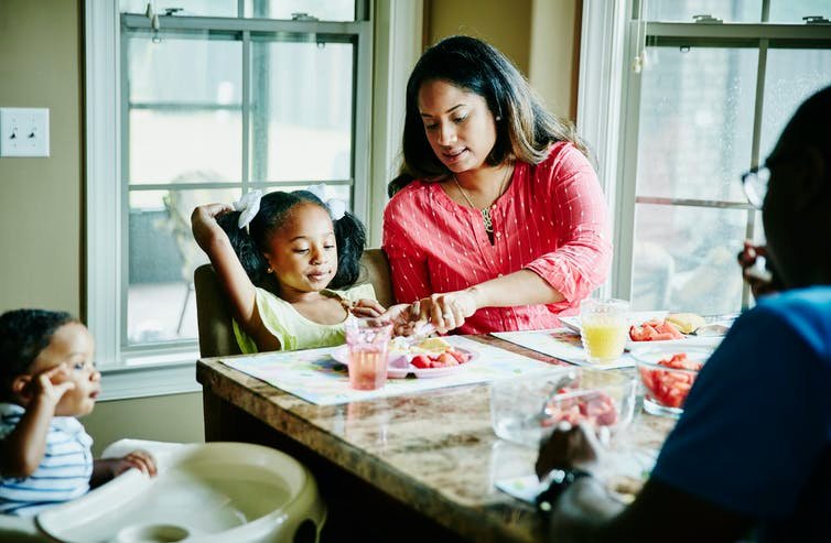 Moms and dads have better physical and mental health when they dine with their children – despite all the work of a family meal. Thomas Barwick/DigitalVision via Getty Images