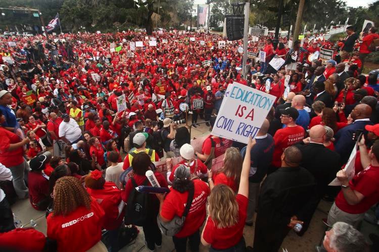 Teachers and supporters march Monday, Jan. 13, 2020, during the Florida Education Association's "Take on Tallahassee" rally at the Old Capitol in Tallahassee, Fla. 
Phil Sears / AP