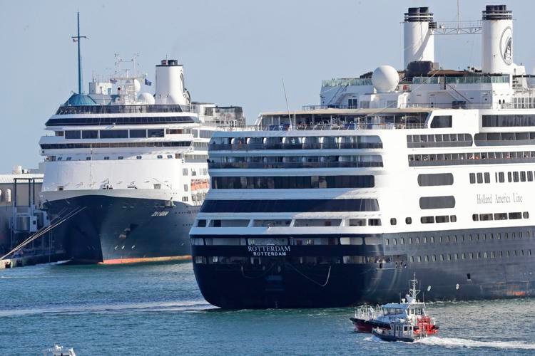 The cruise ship Rotterdam (right) passes the Zaandam as it prepares to dock Thursday, April 2, at Port Everglades in Fort Lauderdale, Fla. Wilfredo Lee / AP