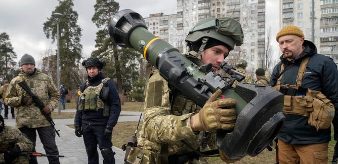 A Ukrainian Territorial Defence Forces member holds an anti-tank weapon in the outskirts of Kyiv on March 9.