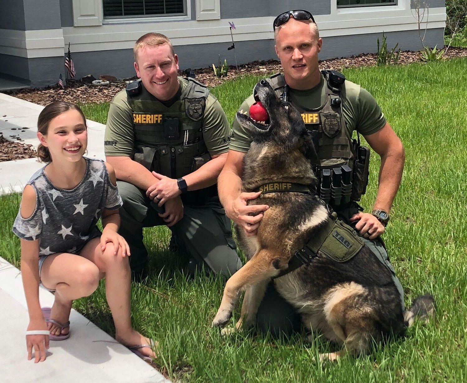 Emma Stanford, Chief Jonathan Welker, and Sgt. Robert Tarczewski and his partner K9 Tag, June 2018.