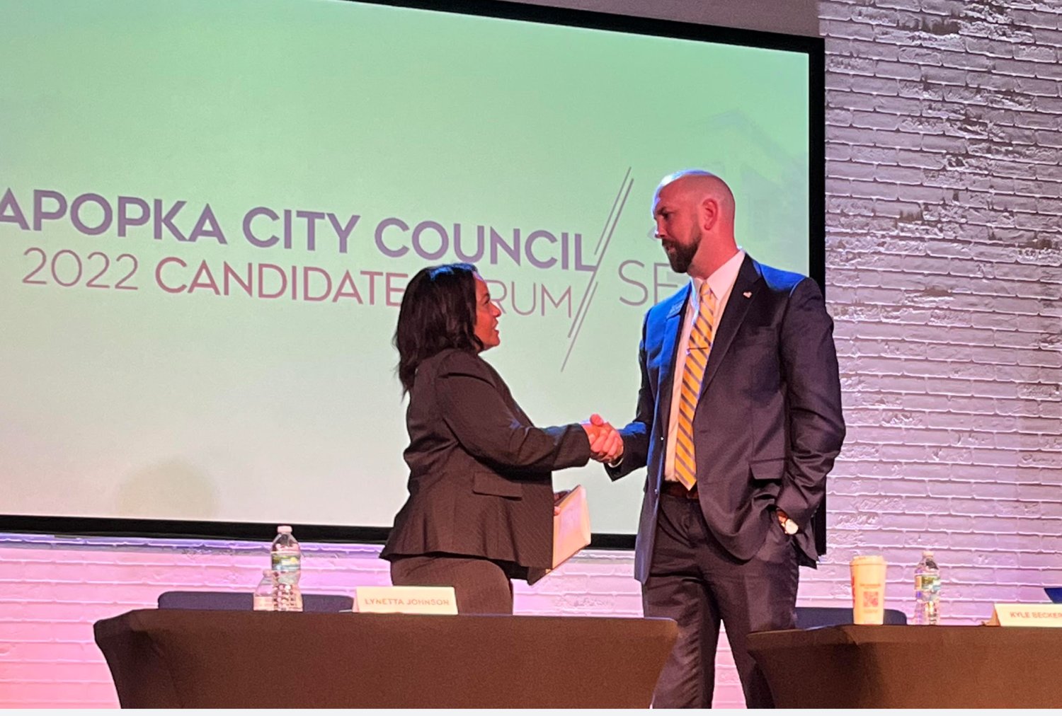Lynetta Johnson and Kyle Becker shake hands after their  Thursday debate, just two days before the social media meltdown.