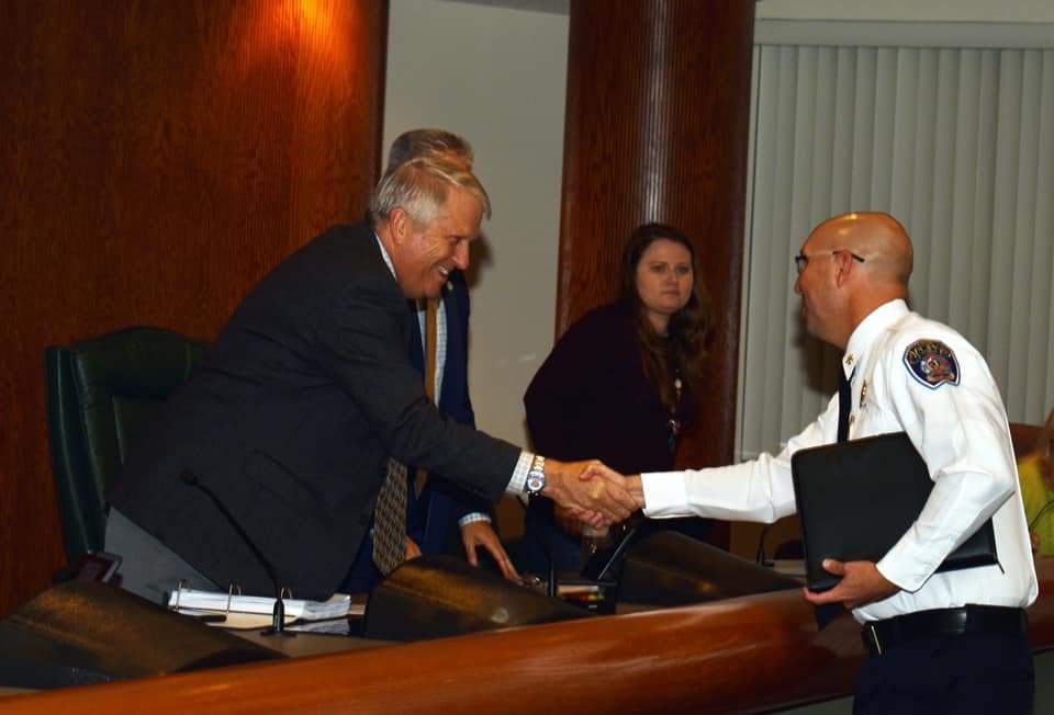 Apopka Mayor Bryan Nelson shakes the hand of newly appointed Apopka Fire Chief Sean Wylam in 2019.