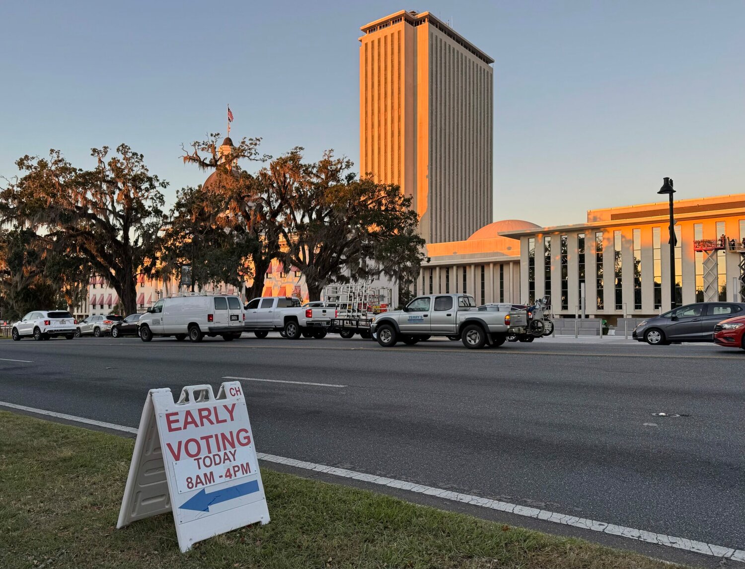 Floridians began early voting in most Florida counties on Oct. 21, 2024. The Florida Capitol stands in the background of an early voting sign at the Leon County Courthouse.