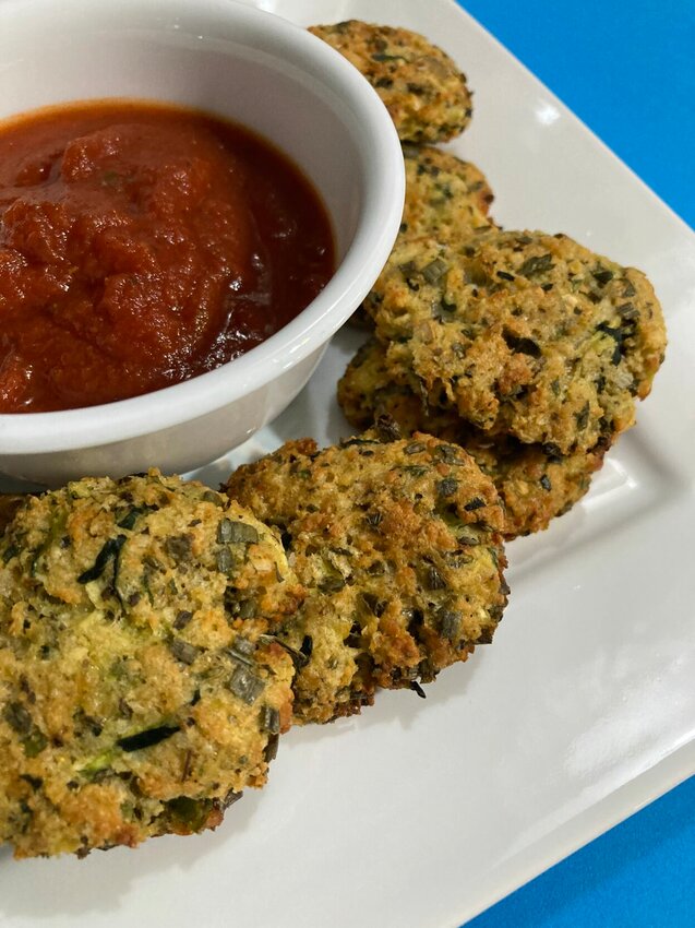 Zucchini-Garlic Bites, shown with marinara sauce, make a perfect appetizer or later summer snack.&nbsp;   Linda Masters/The Baxter Bulletin