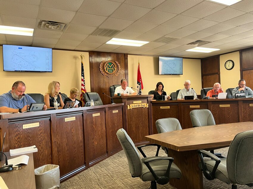 Members of the Mountain Home City Council, along with Mayor Hillrey Adams, listen during a recent meeting. The council approved funds Thursday evening to meet required mandates to uphold security measures.   Bulletin File Photo
