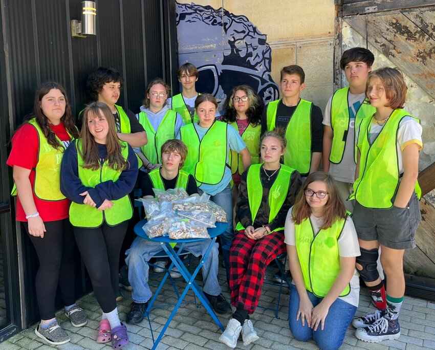 Area youths volunteered Friday to tidy up downtown Mountain Home as part of annual Keep Arkansas Beautiful campaign. The annual event is held statewide each October. The youths picked hundreds of cigarette butts in the area and were treated to lunch at Rio Burrito.   Submitted Photo