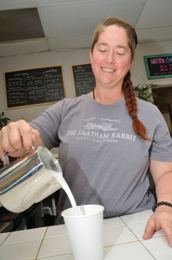 Brooke Simmons pours milk for one of her specialty coffees at her shop, The Chatham Rabbit on North Chatham Avenue in Siler City. She is a new business owner in town after having opened in October. She opened the space when the previous tenants left to open the Peppercorn.