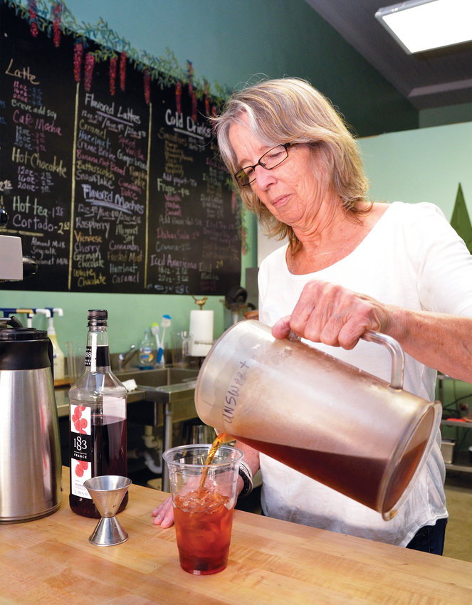 Joan Underwood creates a raspberry tea Friday morning at The Peppercorn in Siler City. The event venue and morning brew stop has been open since late 2016.