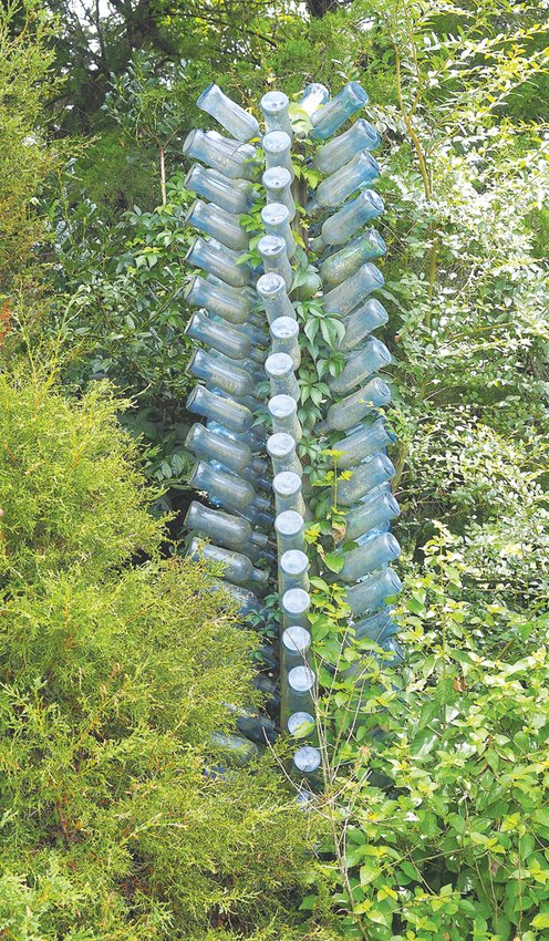 Bottles in trees were originally thought to trap evil spirits from getting into the home. Bottle trees are popular garden ornaments in Chatham County.