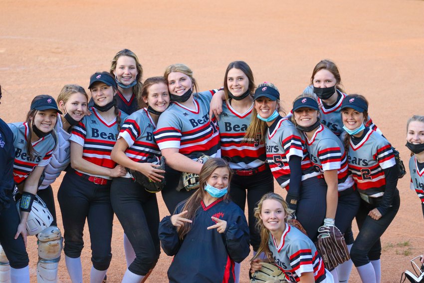 The Chatham Central softball team poses in the infield after their 14-1 win over Jordan-Matthews on Thursday, April 22.
