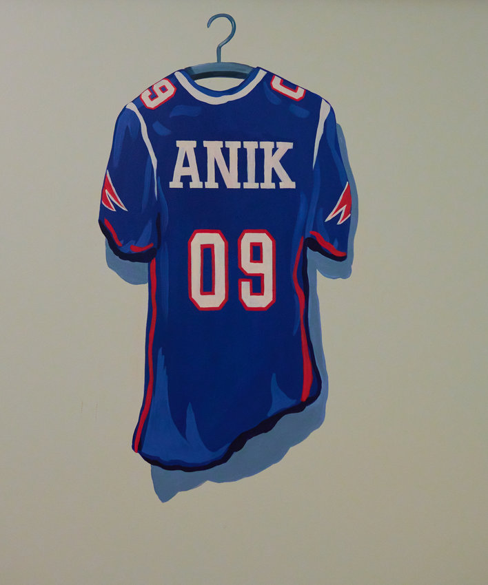 On the wall of his room, Anik Gupta has a custom jersey painted to show off his favorite team: the New England Patriots.